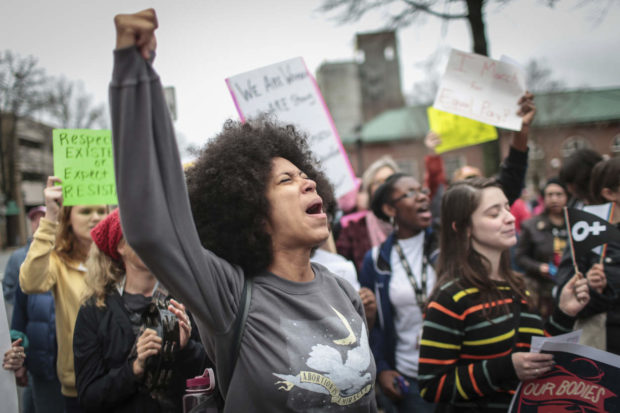 Mariah Parker chants during the Athens Women's March at the Athena statue in downtown Athens, Ga., Saturday, Jan. 21, 2017. Roughly 700 people attended the march to pressure President Trump to not roll back women's rights such as access to healthcare, abortions, and equal pay according to organizers. (John Roark/Athens Banner-Herald via AP) NYTCREDIT: John Roark/Athens Banner-Herald, via Associated Press