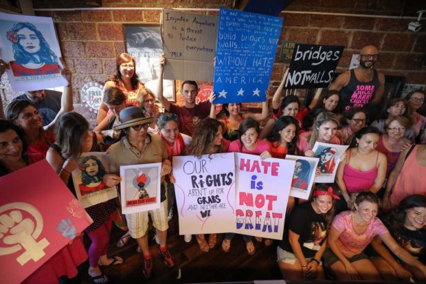 epa05737471 People take part in a sister rally held in solidarity with the upcoming Women's March in Washington, in a show of support for equal rights at a restaurant in Bangkok, Thailand, 21 January 2017. Rallies in over 30 countries around the world are expected to take place following the inauguration of US President Donald J. Trump. EPA/DIEGO AZUBEL NYTCREDIT: Diego Azubel/European Pressphoto Agency