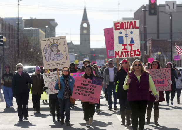 People march up Capitol Avenue on the way to the Wyoming Supreme Court during a Women's March Saturday, Jan. 21, 2017, in Cheyenne, Wy. Around 1,500 and 2,000 people took park in the march to focus on the rights of women and other minority and disadvantaged groups. (Blaine McCartney/The Wyoming Tribune Eagle via AP) NYTCREDIT: Blaine Mccartney/The Wyoming Tribune Eagle, via Associated Press