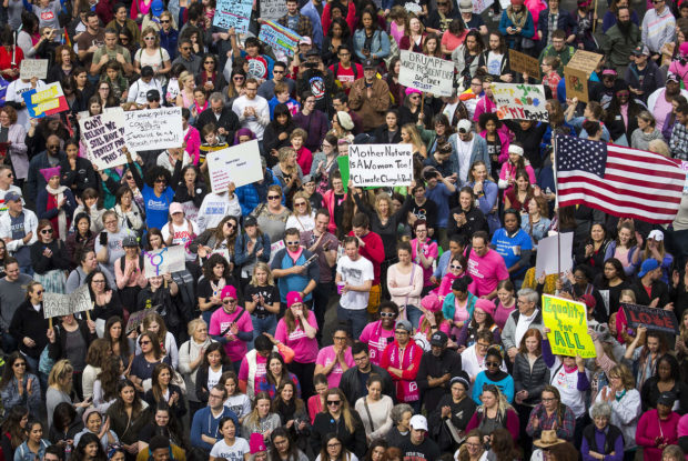 Participants in the Dallas Women's March cheer speakers as they rally outside the at the Communications Workers of America Hall on Washington on Saturday, Jan. 21, 2017, in Dallas. The Dallas event was held in solidarity with the Women's March on Washington. (Smiley N. Pool/The Dallas Morning News via AP) NYTCREDIT: Pool photo by Smiley N.