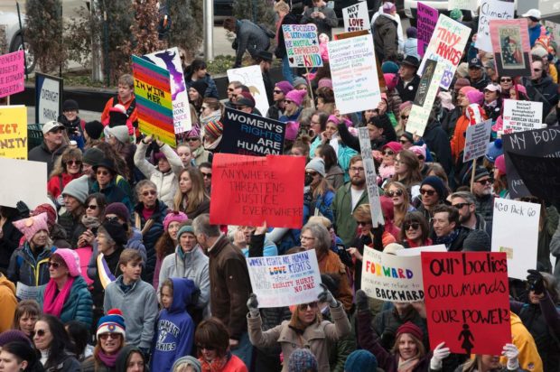 Demonstrators gather at Civic Center Park in Denver, Colorado, during the Women's March on January 21, 2017. Hundreds of thousands of people packed the streets across the US on Saturday in a massive outpouring of defiant opposition to America's new president, Donald Trump. / AFP PHOTO / Jason ConnollyJASON CONNOLLY/AFP/Getty Images NYTCREDIT: Jason Connolly/Agence France-Presse -- Getty Images