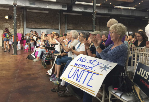 In a Saturday, Jan. 21, 2017 photo, people cheer as moderator Carol Ferguson gives a speech at the Gulf Coast Solidarity Rally at Cafe Climb in Gulfport, Miss., before their Women's Marchin Gulfport, Miss. About 300 people attended the event held in conjunction with the Women's March in Washington D.C. (Justin Mitchell/The Sun Herald via AP) NYTCREDIT: Justin Mitchell/The Sun Herald, via Associated Press