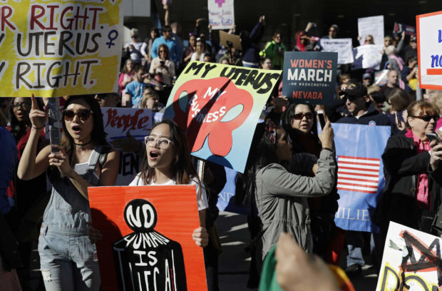 People protest newly inaugurated President Donald Trump during a women's march Saturday, Jan. 21, 2017, in Las Vegas. (AP Photo/John Locher) NYTCREDIT: John Locher/Associated Press