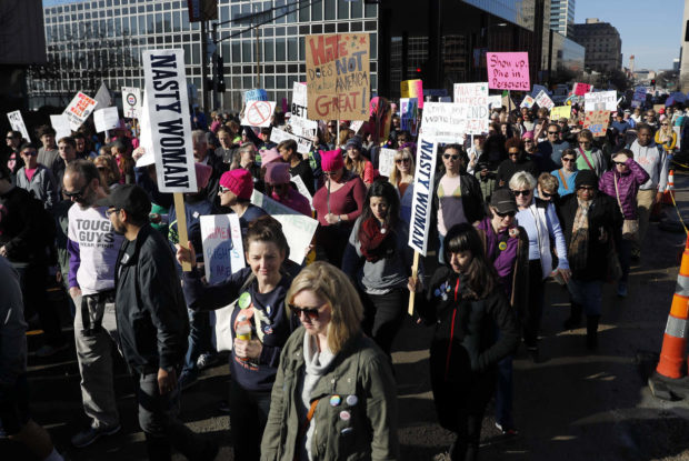 Thousands of people participate in a Women's March Saturday, Jan. 21, 2017, in St. Louis. The march was held in in conjunction with with similar events taking place in Washington and around the nation following the inauguration of President Donald Trump. (AP Photo/Jeff Roberson) NYTCREDIT: Jeff Roberson/Associated Press