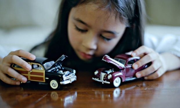 girl-plays-with-toy-cars-012