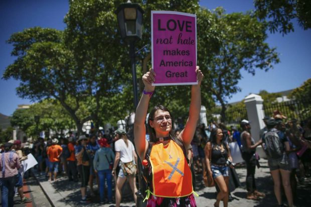 epa05738478 Protestors take to the streets of Cape Town during a womens rights and anti Trump march to Parliament in Cape Town, South Africa, 21 January 2017. Protest rallies were held in over 30 countries around the world in solidarity with the Women's March on Washington in defense of press freedom, women's and human rights following the official inauguration of Donald J. Trump as the 45th President of the United States of America in Washington, DC, USA, on 20 January 2017. EPA/NIC BOTHMA NYTCREDIT: Nic Bothma/European Pressphoto Agency