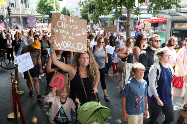 AUCKLAND, NEW ZEALAND - JANUARY 21: Thousands of people march up Queen Street on January 21, 2017 in Auckland, New Zealand. The marches in New Zealand were organised to show solidarity with those marching on Washington DC and around the world in defense of women's rights and human rights. (Photo by Fiona Goodall/Getty Images) NYTCREDIT: Fiona Goodall/Getty Images