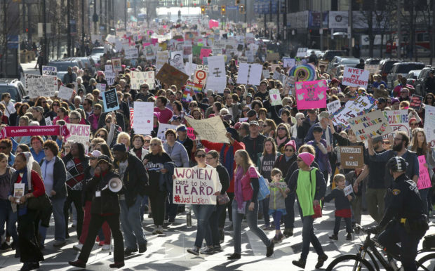 Protesters fill Ontario Street during a Women's March on Cleveland on Saturday, Jan. 21, 2017. The march was held in in conjunction with with similar events taking place around the nation following the inauguration of President Donald Trump. (Thomas Ondrey/The Plain Dealer via AP) NYTCREDIT: Thomas Ondrey/The Plain Dealer, via Associated Press