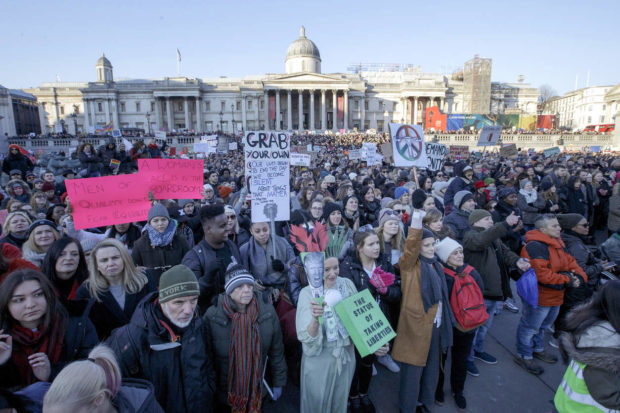 Demonstrators take part in the Women's March in Trafalgar Square, central London following the Inauguration of U.S. President Donald Trump in London, Saturday Jan. 21, 2016. The march is being held in solidarity with the Women's March in Washington, and other cities worldwide, advocating women's rights and opposing Donald Trump's U.S. presidency. National Gallery in background. (AP Photo/Tim Ireland) NYTCREDIT: Tim Ireland/Associated Press