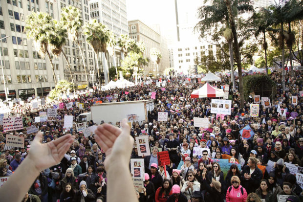 Protesters listen to a speaker as they gather for the Women's March against President Donald Trump Saturday, Jan. 21, 2017, in Los Angeles. The march is being held in solidarity with similar events taking place in Washington and around the nation. (AP Photo/Jae C. Hong) NYTCREDIT: Jae C. Hong/Associated Press