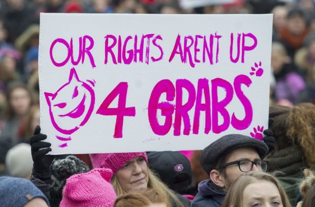 A woman holds up a sign during a demonstration to protest the inauguration of U.S. President Donald Trump in Montreal, Saturday, Jan. 21, 2017. Protests are being held across Canada today in support of the Women's March on Washington. Organizers say 30 events in all have been organized across Canada, including Ottawa, Toronto, Montreal and Vancouver. (Graham Hughes/The Canadian Press via AP) NYTCREDIT: Graham Hughes/The Canadian Press, via Associated Press