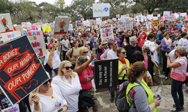 Over 1,000 people gather to take part in a Women's March at Washington Square Park in New Orleans, Saturday, Jan. 21, 2017. (AP Photo/Max Becherer) NYTCREDIT: Max Becherer/Associated Press