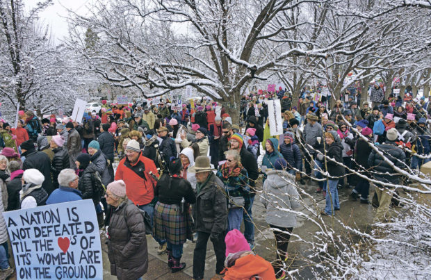 Protesters gather at the east entrance to the New Mexico State Capitol during a sister march in Santa Fe, New Mexico to the D.C. Women's March on Washington. The march went from the Bataan Memorial Building, around the Santa Fe Plaza and then to the New Mexico State Capitol for a noon to 2 p.m. rally Saturday, Jan. 21, 2017. (Clyde Mueller/Santa Fe New Mexican via AP) NYTCREDIT: Clyde Mueller/Santa Fe New Mexican, via Associated Press