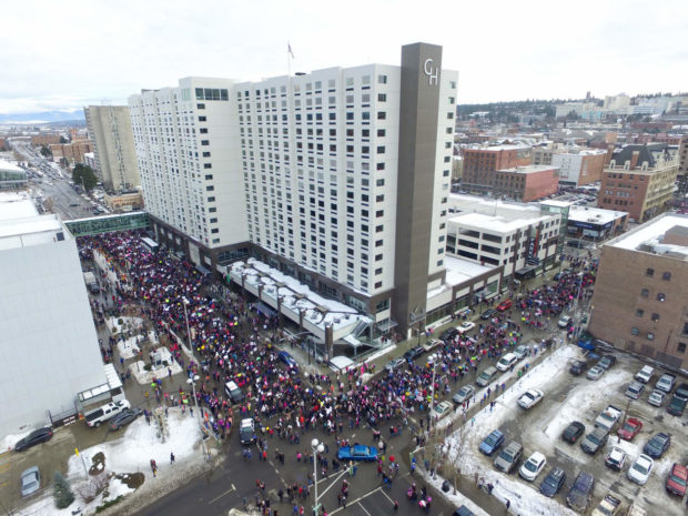 Thousands of protesters walk around the Grand Hotel in downtown Spokane, Saturday, Jan. 21, 2017. The Woman's March took place in many cities across the nation to protest the policies and proposals of the new president, Donald Trump. (Jesse Tinsley/The Spokesman-Review via AP) NYTCREDIT: Jesse Tinsley/The Spokesman-Review, via Associated Press